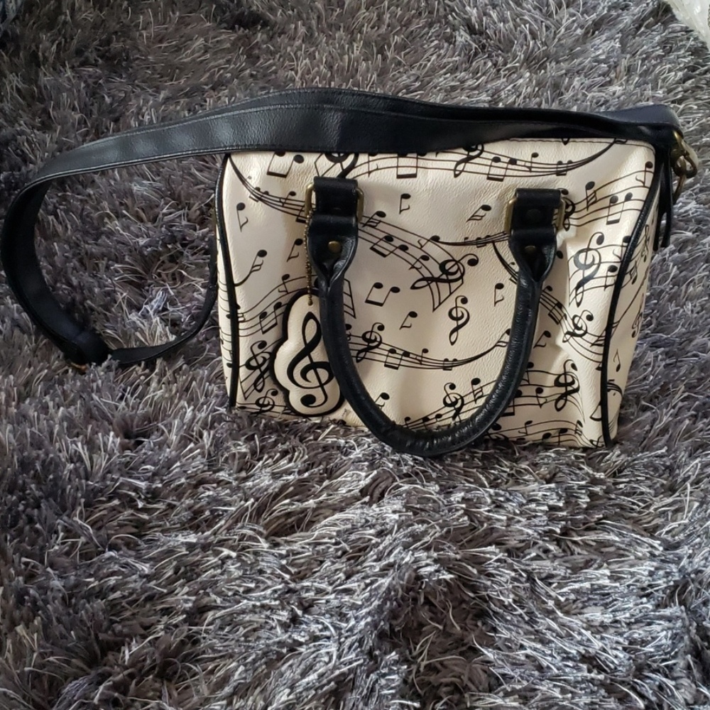 Beige music notes purse